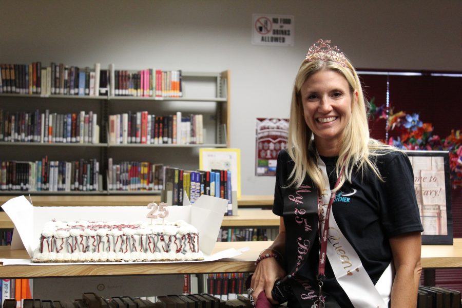 Principal Michelle Kefford stands in front of her 25th birthday cake. Photo by Bianca Navas