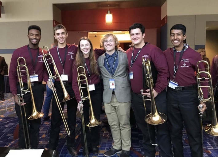 Frybergh (second from left), composer Harrison J. Collins and some members of MSD's trombone section are pictured at the Midwest Clinic in Chicago, Illinois. Photo courtesy of Hunter Frybergh