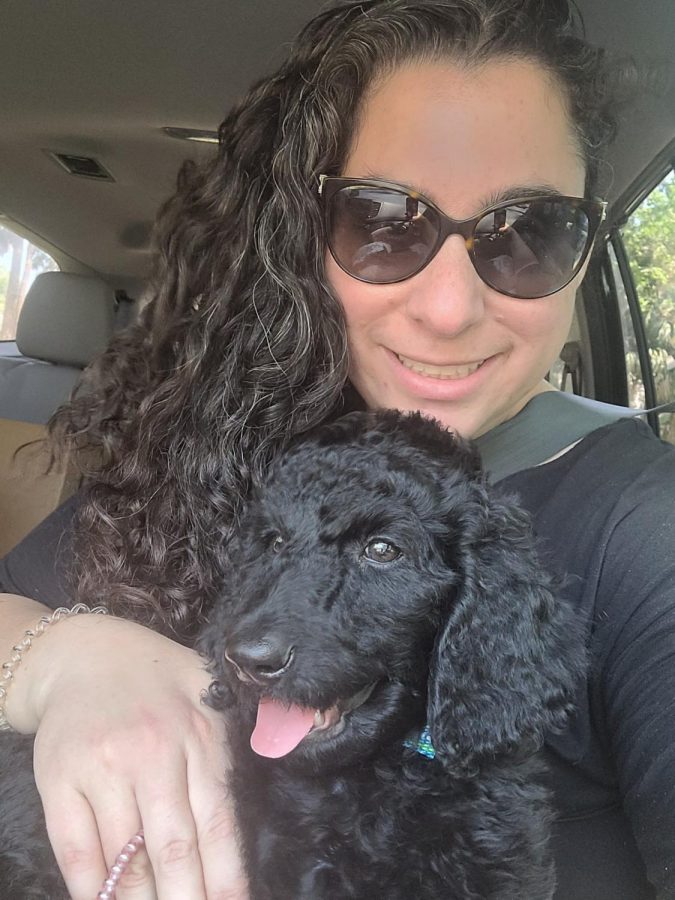 Lieberman sits in her car with her new dog Romeo. Photo courtesy of Jacqueline Lieberman 
