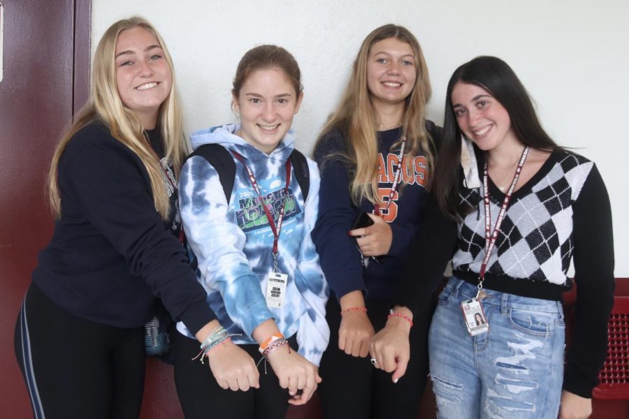 Sophomores Gracyn Haynes, Lily Shortz, Stephanie Bilsky, and Emma Kramer show off their handmade bracelets they created together for their ocean conservation business. The girls decided to form a business that makes and sells bracelets in order to help protect and preserve the ocean's environment.