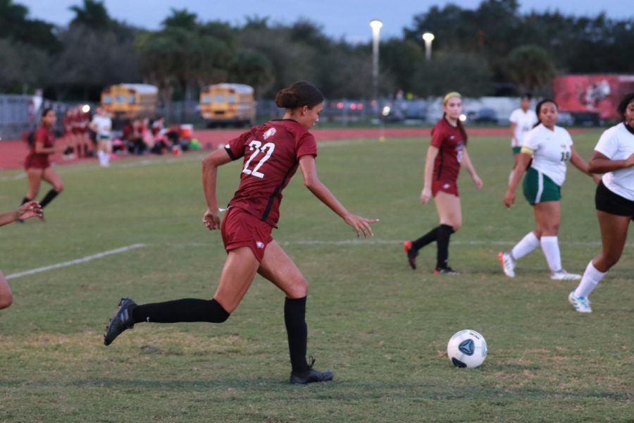 Senior Sahai Simmonds (22) aimed to score a goal against Nova High School on her "Senior Night."