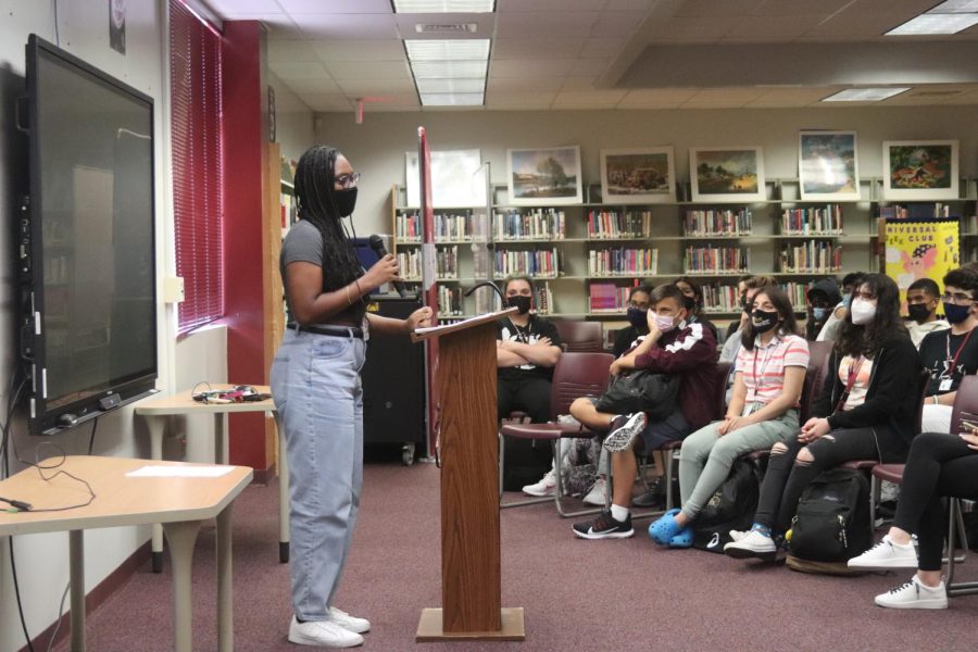 Tapping Into Character. Junior Noldine Belizaire acts out a monologue in the media center from the book “With Their Eyes” on Friday, Sept. 10, as a part of the Drama Club’s presentation. In remembrance of Sept. 11, 2001, “With Their Eyes” contains 23 perspectives of students and faculty at Stuyvesant High School that witnessed the terrorist attacks on the World Trade Center in New York City. 