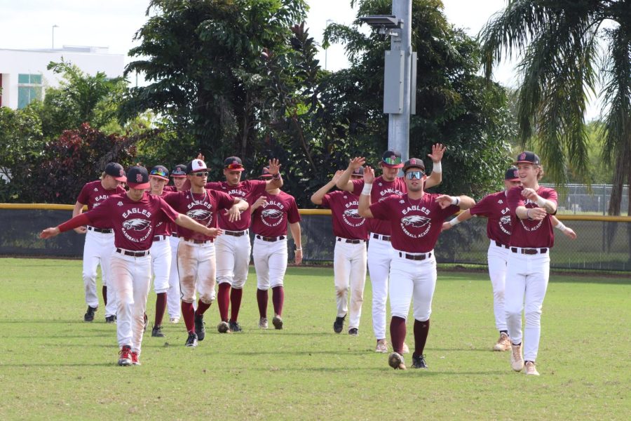 Club Doug, MSD's baseball program, warms up before a preseason game by completing their routine stretches. The game was one of many in preparation for the spring season.