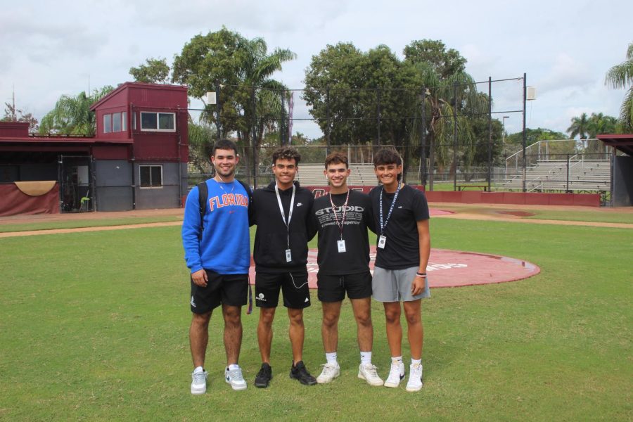 The Rodriguez family stands in front of the mound at Marjory Stoneman Douglas High School's baseball field. Christian, Angel, Jonathan and Alex are all key members of the MSD baseball team.