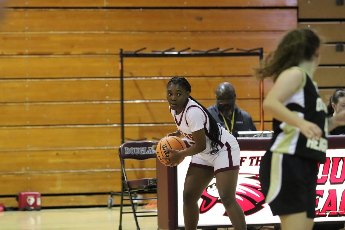 Daria Boykin (21) looks to her teammates to pass the ball. The Eagles were victorious against Olympic Heights by a 16-point lead.